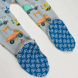Footie with construction vehicle pattern and blue feet with heart pattern on a white background