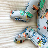 Children's socks with vehicle pattern on a soft fabric background