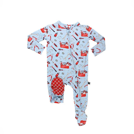 Baby onesie with red toolbox pattern on a light blue background