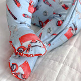 Fabric with red and gray tool pattern on a light blue background