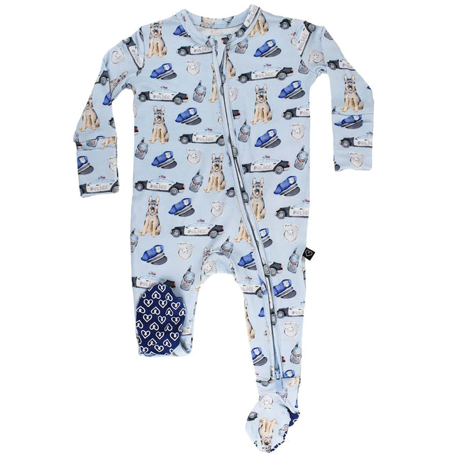 Baby onesie with police car and dog pattern on a light blue background