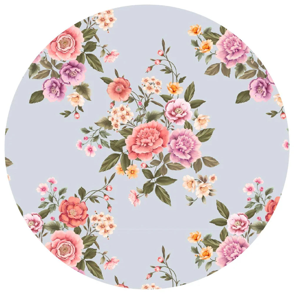 Floral patterned plate with pink, purple, and orange flowers on a light blue background