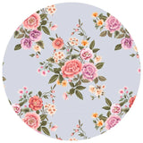 Floral patterned plate with pink, purple, and orange flowers on a light blue background