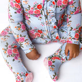 Floral-patterned baby onesie on a white background