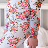 Floral patterned outfit with long sleeves and a light background