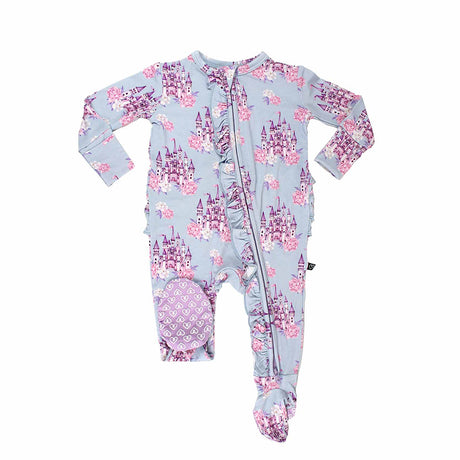 Baby onesie with castle and floral pattern on a light blue background