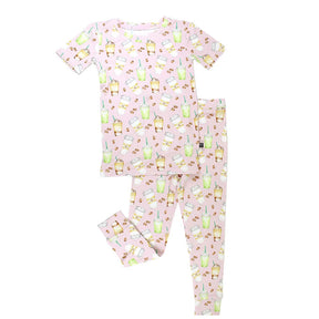 Children's pajama set with coffee pattern on a pink background