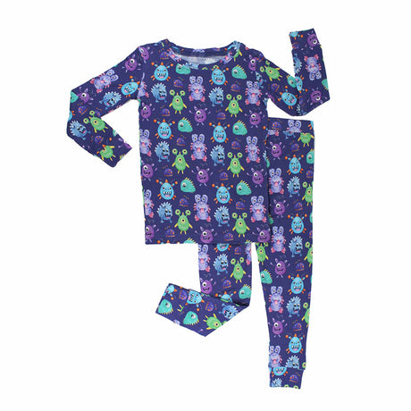 Children's pajama set with monster pattern on a white background
