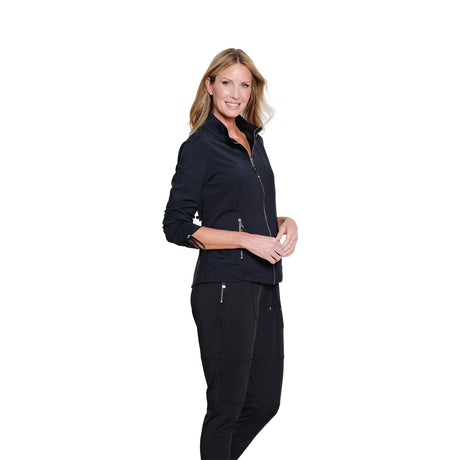 Woman wearing a black jacket and pants on a white background