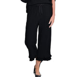 Black wide-leg pants with ruffled hem on a white background