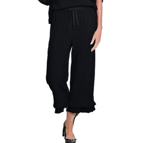 Black wide-leg pants with ruffled hem on a white background