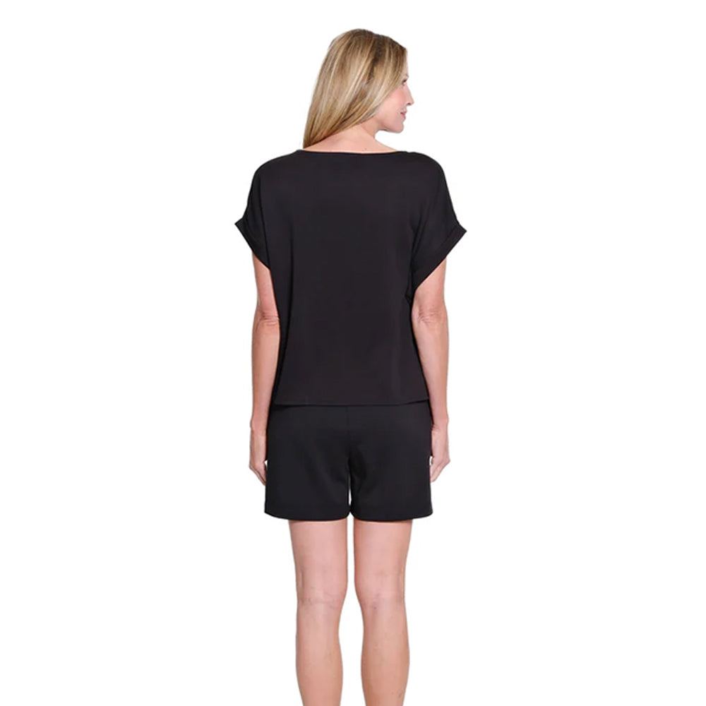 Woman wearing a black outfit on a white background