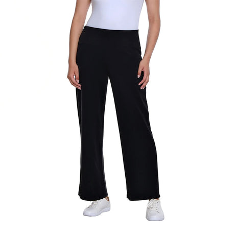 A model wearing black wide-leg cropped pants with a white top and white sneakers, shown from the waist down against a plain white background.