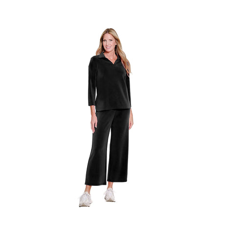 Woman wearing a black outfit on a white background
