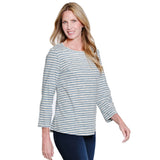 Woman wearing a striped long-sleeve top on a white background