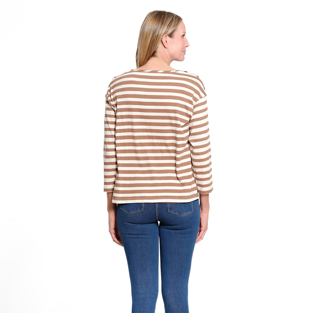 A woman viewed from the back wearing a beige and brown horizontally striped long-sleeve top with blue jeans, set against a plain white background.