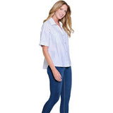 Woman wearing a striped shirt and blue jeans on a white background