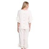 Person wearing a white suit on a white background