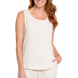 A woman wearing a sleeveless, scoop-neck linen tank top in a light cream or off-white color, paired with matching light pants, shown against a plain white background.