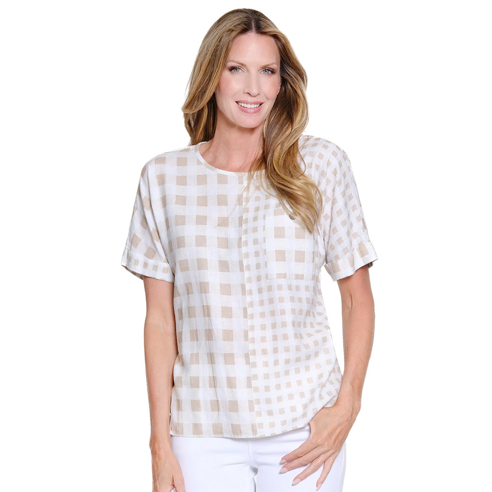 Woman wearing a white and beige checkered blouse on a white background