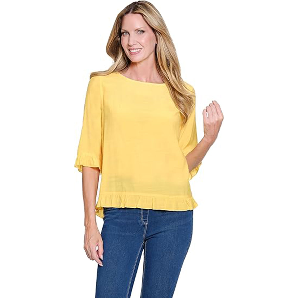 Woman wearing a yellow blouse and blue jeans on a white background
