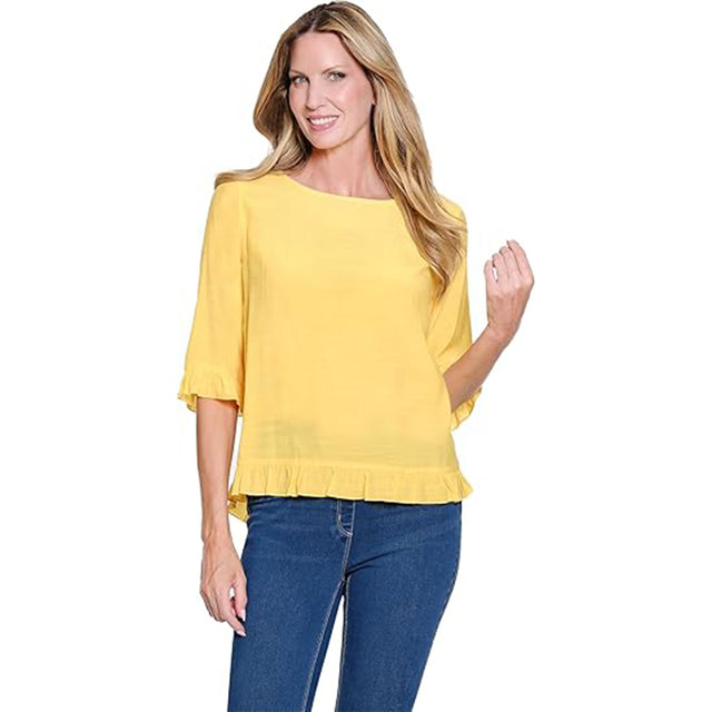 Woman wearing a yellow blouse and blue jeans on a white background