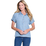 Woman wearing a blue striped shirt and jeans on a white background