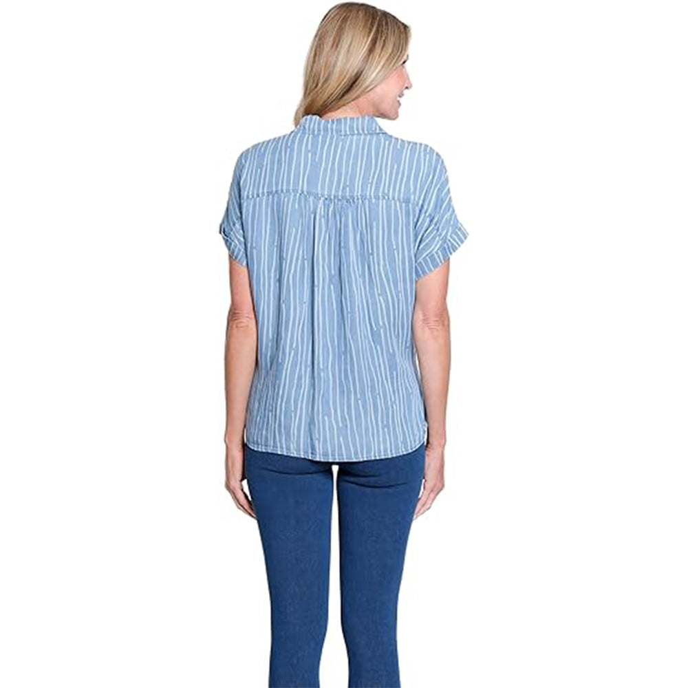 Woman wearing a blue and white striped shirt and blue pants on a white background