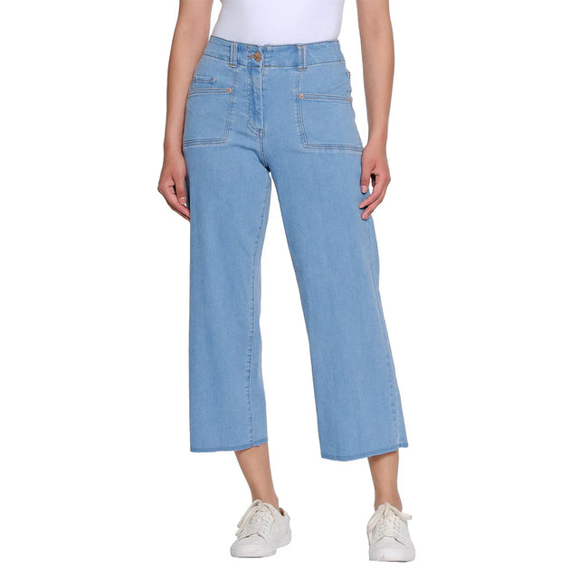 Light blue jeans worn by a person on a white background