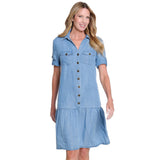 Woman wearing a blue denim dress on a white background