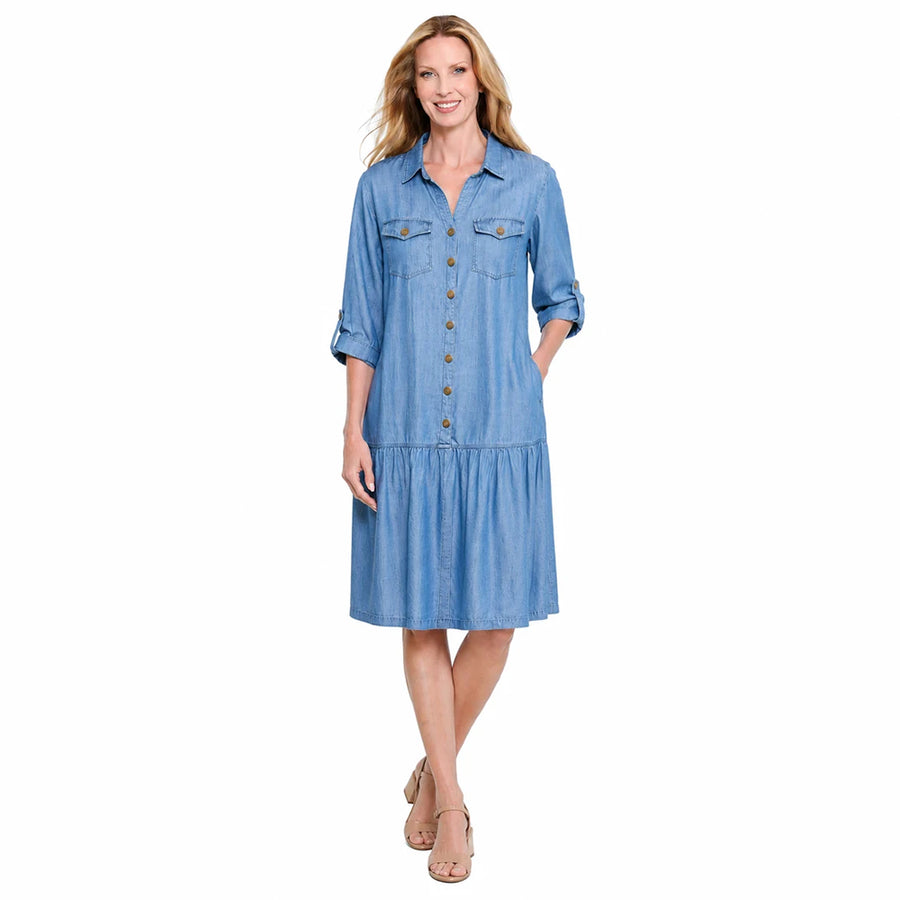 A woman viewed from the front wearing a light blue tiered shirt dress with three-quarter sleeves, shown against a plain white background.
