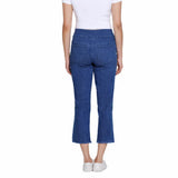 Person wearing blue jeans on a white background