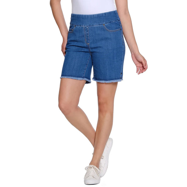 Person wearing blue denim shorts on a white background