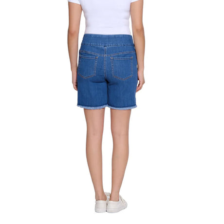 Person wearing blue denim shorts on a white background