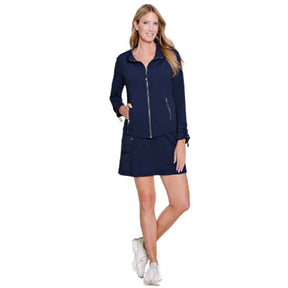 Woman wearing a navy blue outfit with a jacket and skirt on a white background