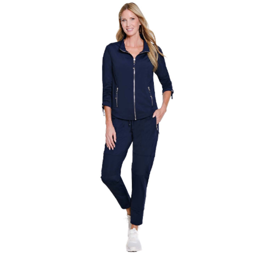 Woman wearing a navy blue tracksuit on a white background