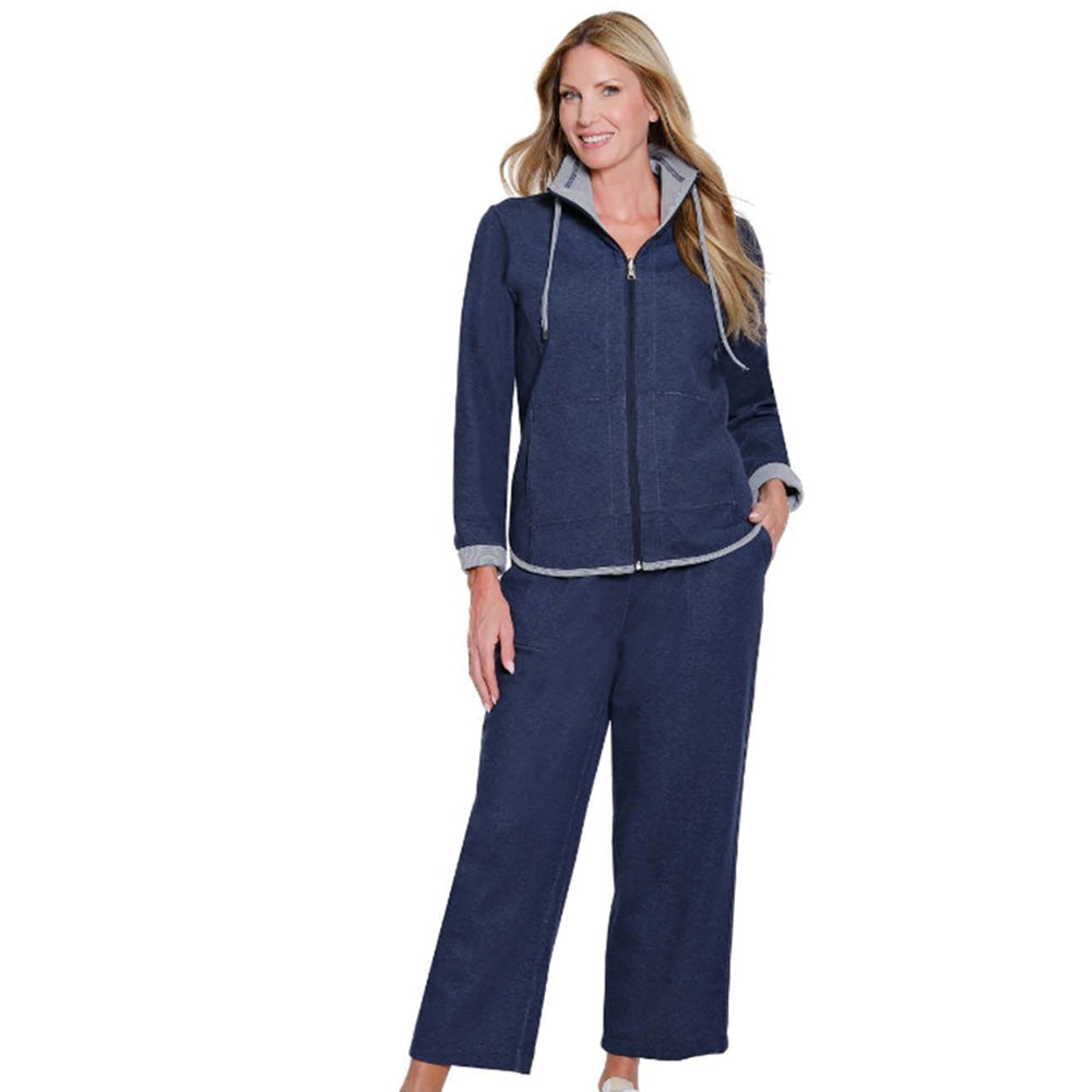 Woman wearing a navy blue tracksuit on a white background