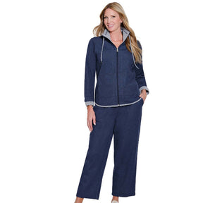 Woman wearing a navy blue tracksuit on a white background