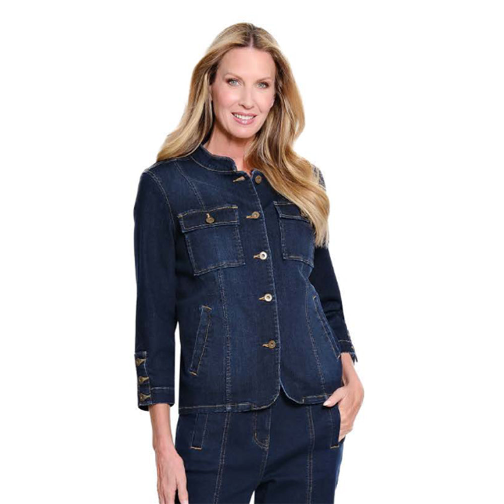 A woman modeling a dark blue denim jacket and matching denim pants against a plain white background.