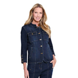 A woman modeling a dark blue denim jacket and matching denim pants against a plain white background.