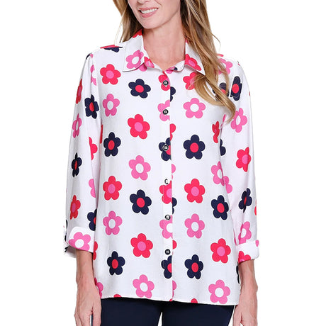 Woman wearing a white blouse with pink and blue floral pattern on a white background