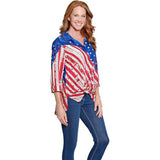 Woman wearing a colorful patterned shirt with an American flag design on a white background