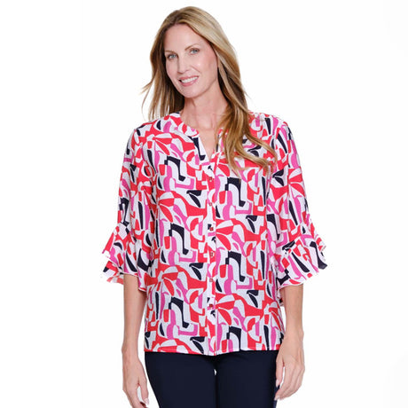Woman wearing a colorful patterned blouse on a white background