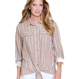 Woman wearing a beige and white striped shirt on a white background