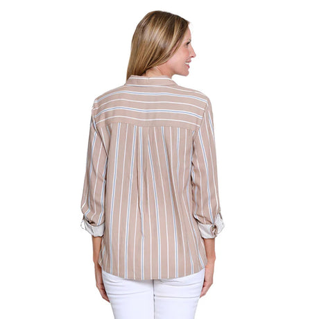 Woman wearing a beige and white striped shirt on a white background
