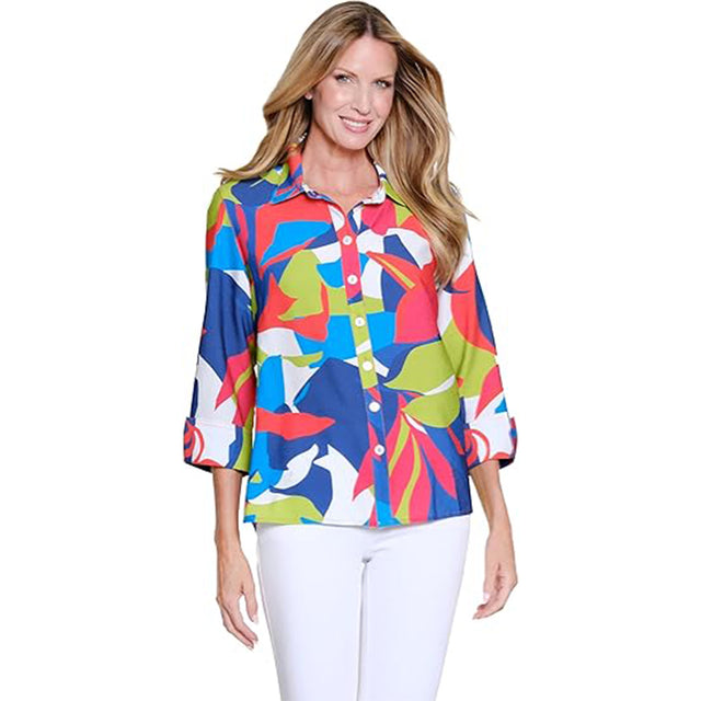 Woman wearing a colorful patterned blouse on a white background