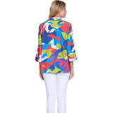 Woman wearing a colorful patterned shirt on a white background