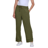 A person wearing olive green wide-leg drawstring pants with a white top and white sneakers, shown against a plain white studio background.