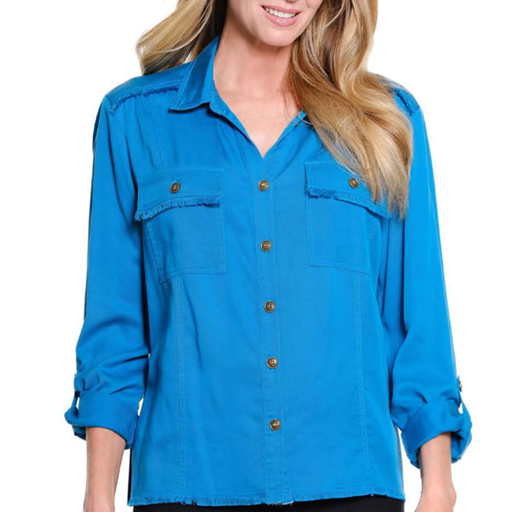 A woman wearing a bright blue button-up shirt with two chest pockets, frayed pocket edges, and brown buttons, shown against a plain white background.