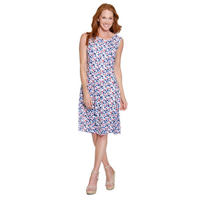 Woman wearing a sleeveless floral dress on a white background